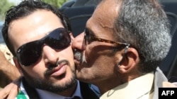 Muntadhar al-Zaidi (left) is welcomed by supporters in Baghdad after his release from prison in September 2009.