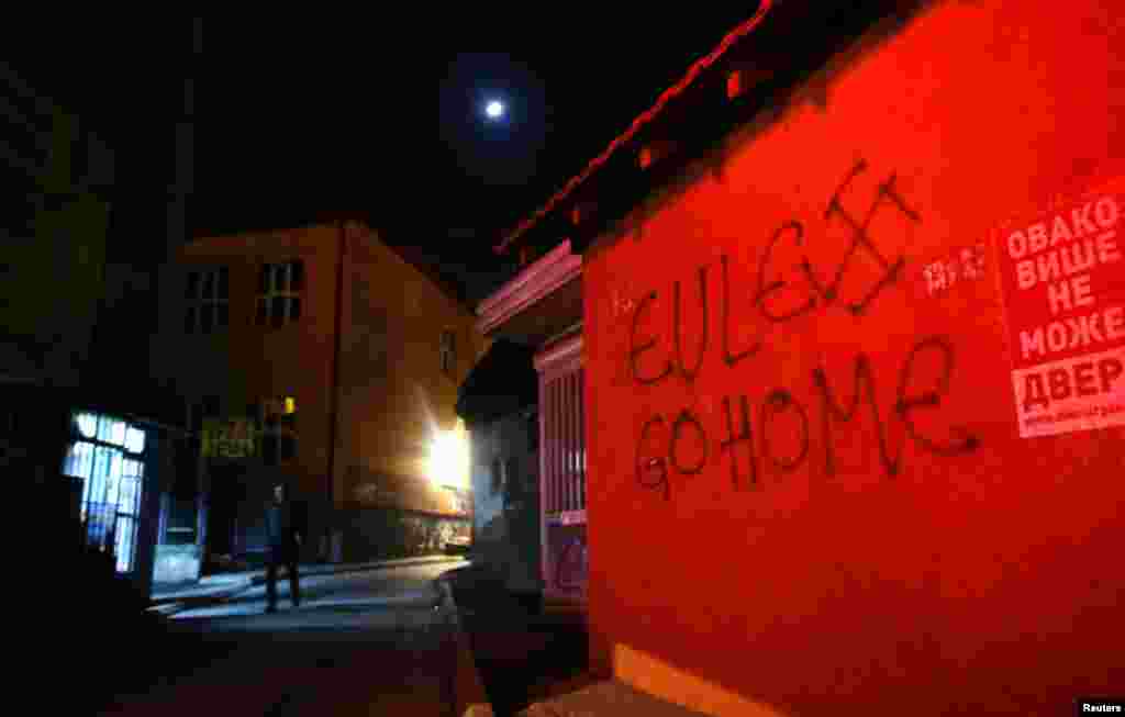 A spray-painted slogan reads, &quot;Eulex go home,&quot; referring to the EU police mission in Kosovo.