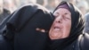 Mourners react near the bodies of Palestinians killed in Israeli air strikes in Khan Younis on January 17. 