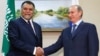 The Kremlin has denied that Russian President Vladimir Putin (right) and Saudi Prince Bandar bin Sultan bin Abdul Aziz al-Saud discussed a grand bargain on Syria in "detail."