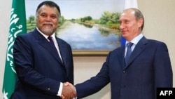 The Kremlin has denied that Russian President Vladimir Putin (right) and Saudi Prince Bandar bin Sultan bin Abdul Aziz al-Saud discussed a grand bargain on Syria in "detail."