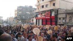 Antigovernment protesters in the Syrian port city of Banias