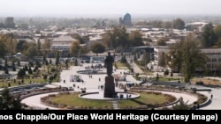 A massive statue of Tamerlane, seen in 2007, towers over UNESCO-protected medieval quarters of Shahrisabz, Uzbekistan before they were bulldozed in a government "tourism development" project.