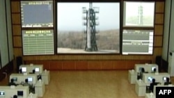 TV grab showing a control room where a three-stage white rocket bearing the word "Chosun" (Korea) appears at an unspecified launch site. (file photo)