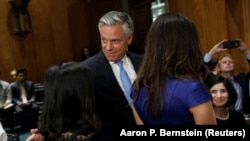 Jon Huntsman departs following a Senate Foreign Relations Committee hearing on his nomination to be ambassador to Russia on Capitol Hill in Washington, D.C., on September 19.