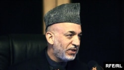 Afghan President Hamid Karzai speaks during an interview with RFE/RL in Kabul on November 1.