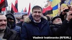 Mikheil Saakashvili stands with supporters during a rally demanding President Petro Poroshenko's resignation in Kyiv on February 4.