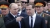 Russian President Vladimir Putin (left) to former Prime Minister Dmitry Medvedev: "I'm tired, you're going." 