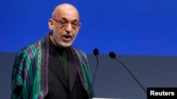 "The New York Times" reports that Afghan President Hamid Karzai (pictured) has requested a personal letter from U.S. President Barack Obama acknowledging U.S. mistakes in Afghanistan.