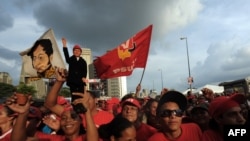 Supporters of Venezuelan President Hugo Chavez at a rally for United Socialist Party of Venezuela (PSUV) candidates in Caracas on September 23.