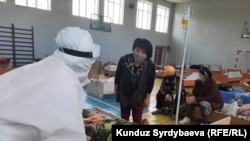 Doctors in Issyk-Kul, Kyrgyzstan, treat suspected patients with COVID-19 on July 16.