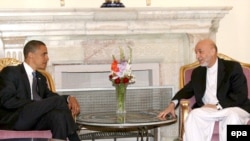 U.S. President-Elect Barack Obama (left) met with Afghan President Hamid Karzai in Kabul during the campaign in July.