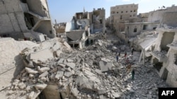 Destruction in Aleppo following barrel bombing by Syrian government forces (file photo)