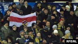 BATE fans fly the banned opposition national white-red-white flag at a game in 2008. Will the political activity of the club's president rub off on the team's popularity?