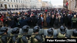 Riot police officers guard the area outside the St Petersburg Legislative Assembly building during a rally in support of Aleksei Navalny on January 31.