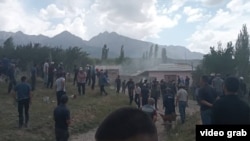 Villagers started throwing stones at each other before several houses on each side were set on fire on May 31.