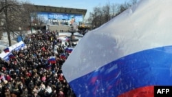 Members of the pro-Kremlin youth groups take part in a rally in Moscow's Pushkin Square on March 11 to mark the upcoming 2012 presidential election.