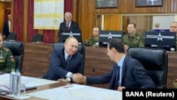 Syrian President Bashar al-Assad (right) has held power with the help of Russia's Vladimir Putin. (file photo)