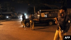 Pakistani police at a security checkpoint on February 17 in Karachi, where security forces captured Mullah Abdul Ghani Baradar.