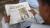 A Pakistan man reads a copy of the English-language Dawn newspaper in Karachi. Reporters Without Borders has condemned the disruption in distribution of Pakistan's oldest newspaper after it published a controversial interview with ousted Prime Minister Nawaz Sharif.