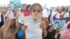 Thousands of women, children, and men held up photos, placards, or the natoinal ID cards of their missing family members.