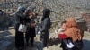 An Afghan health worker administers polio vaccine drops to a child during an inoculation campaign in the old quarters of Kabul. (file photo)