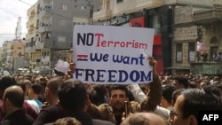 Antigovernment protesters take part in a demonstration in the northeastern city of Banias on April 22.