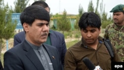 Governor Mohammad Omer Safi (left) has blamed the fall of Kunduz on "regional intelligence officials." (file photo)