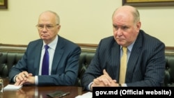 Russian Deputy Foreign Minister Grigory Karasin (right) has vowed a "tough" response.