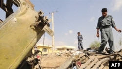 The site of a bomb blast at a city police post in western Kabul