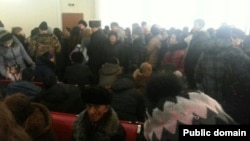 Clients line up at Kaspi Bank in Astana to withdraw their savings on February 18.