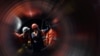 Workers are seen through a pipe at the construction site of the Nord Stream 2 gas pipeline. (File photo)