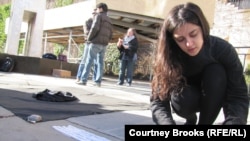 "I'm really hopeful that this project will raise awareness among people, and also that [it will fill] an empty part of the puzzle of the sanctions -- which is only a word but it involves people's actual lives," says Sanaz Sohrabi, shown here protesting in front of the UN.