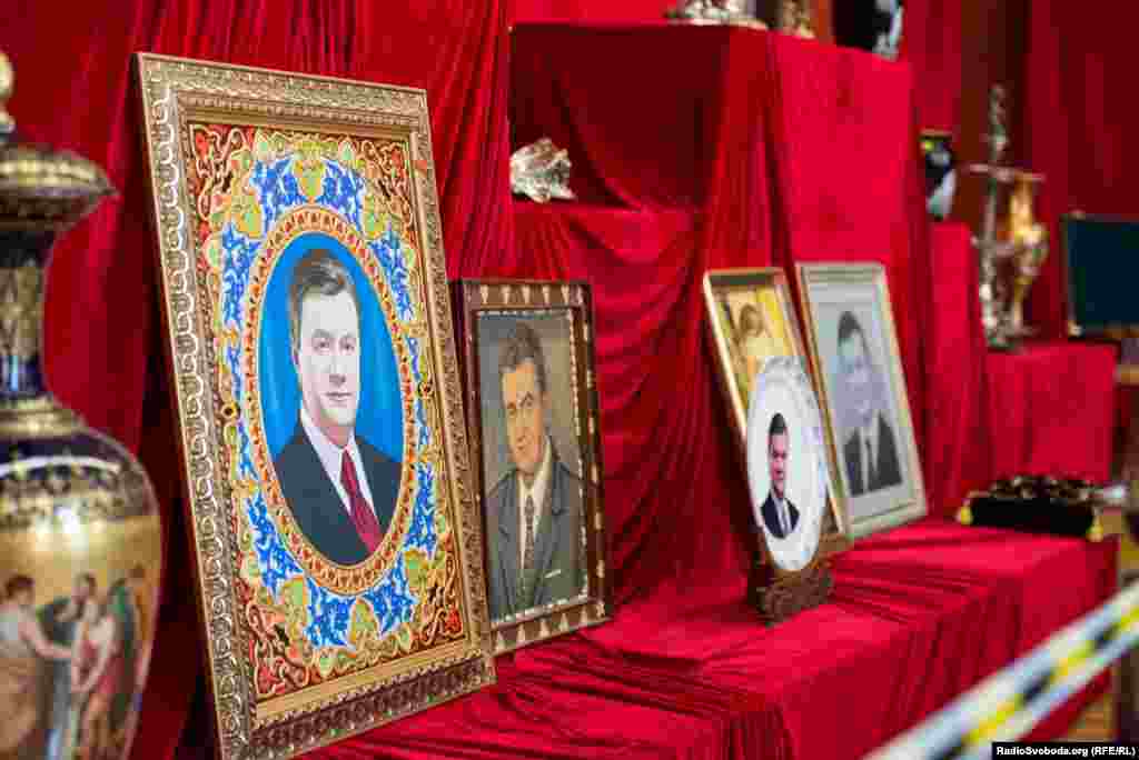 Portraits of former President Viktor Yanukovych greet visitors to the museum exhibit.