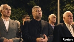 Outgoing South Ossetian leader Eduard Kokoity takes part in a commemoration ceremony, marking the third anniversary of Georgia's war with Russia in Tskhinvali on August 7, 2011.