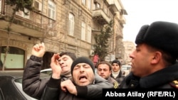 Youth activists are corraled by police in Baku on March 11, when Facebook activists called for "Great People's Day."